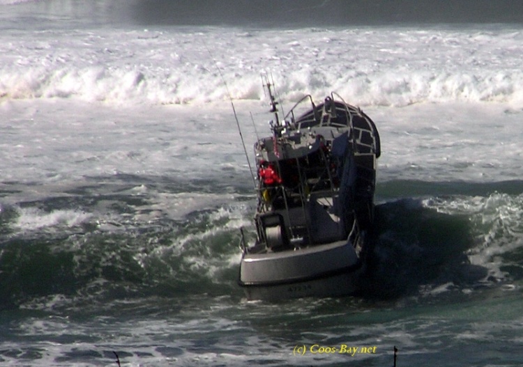 coast guard riding waves